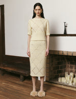 Goose yellow and off-white diamond hollow knitted skirt